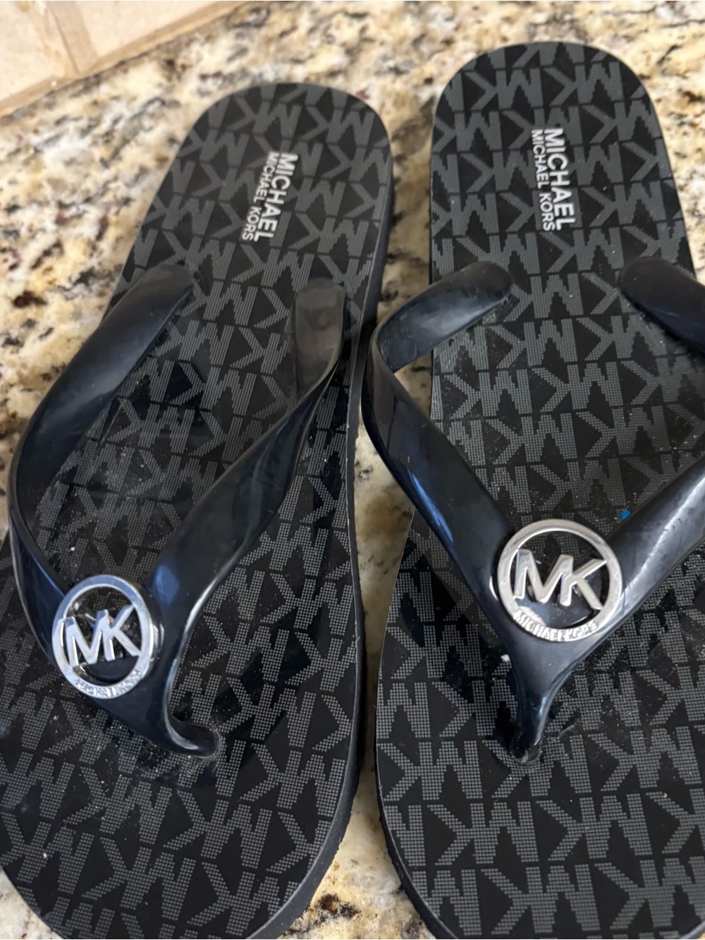 Michael Kors Black Logo Pattern Rubber Flip Flops with Silver MK Emblem